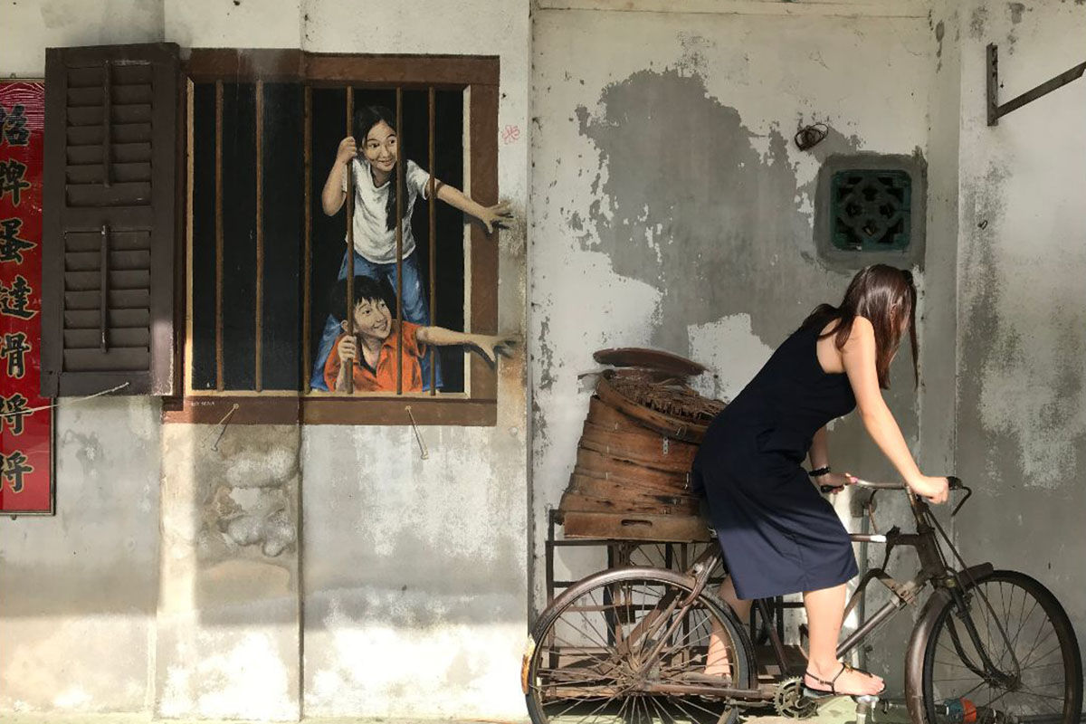 Ernest Zacharevic, the man behind Penang’s world famous murals thinks the heritage area has become a ‘circus’, blaming himself for gentrifying the heritage area, and even considering whitewashing over his art to put an end to the crowds.